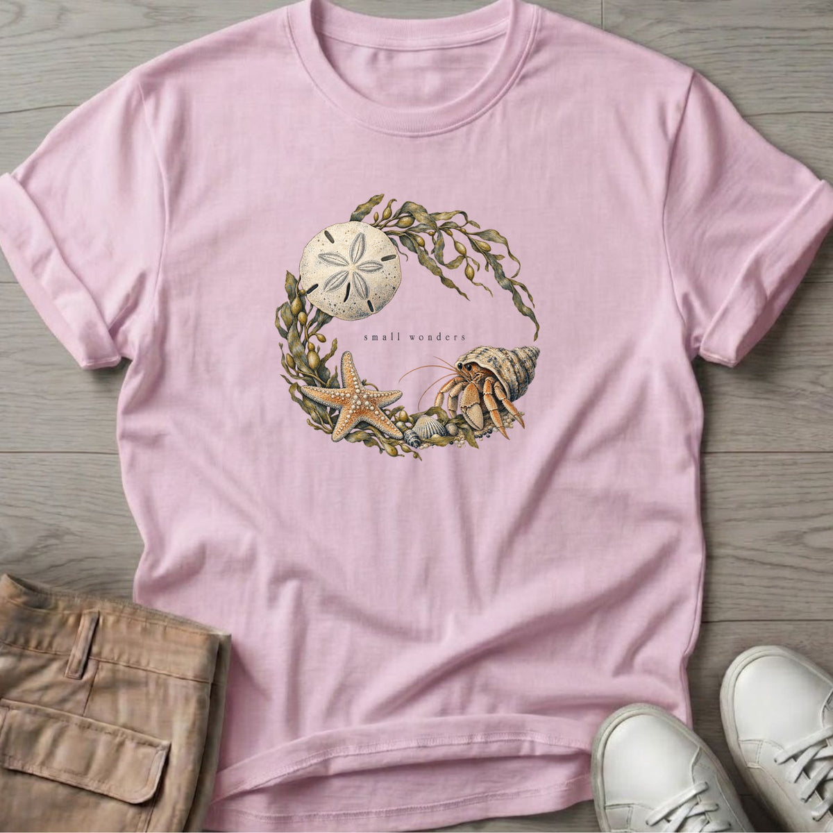 Small Wonders Sand Dollar T-Shirt in Light Pink, Salty Paws Soft Style T-Shirt, front design flat lay