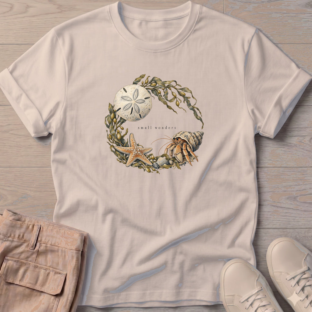 Small Wonders Sand Dollar T-Shirt in Sand, Salty Paws Soft Style T-Shirt, front design flat lay