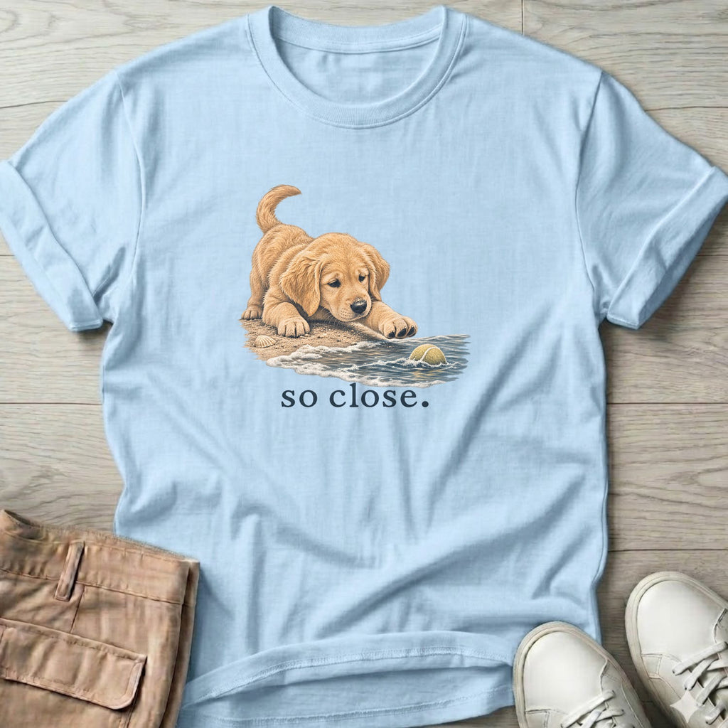 So Close Golden Retriever Puppy 2 T-Shirt in Light Blue, Salty Paws Soft Style T-Shirt, front design flat lay