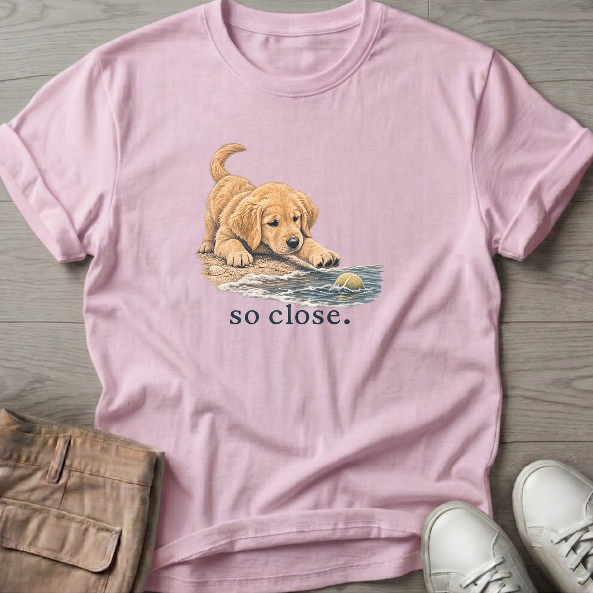 So Close Golden Retriever Puppy 2 T-Shirt in Light Pink, Salty Paws Soft Style T-Shirt, front design flat lay