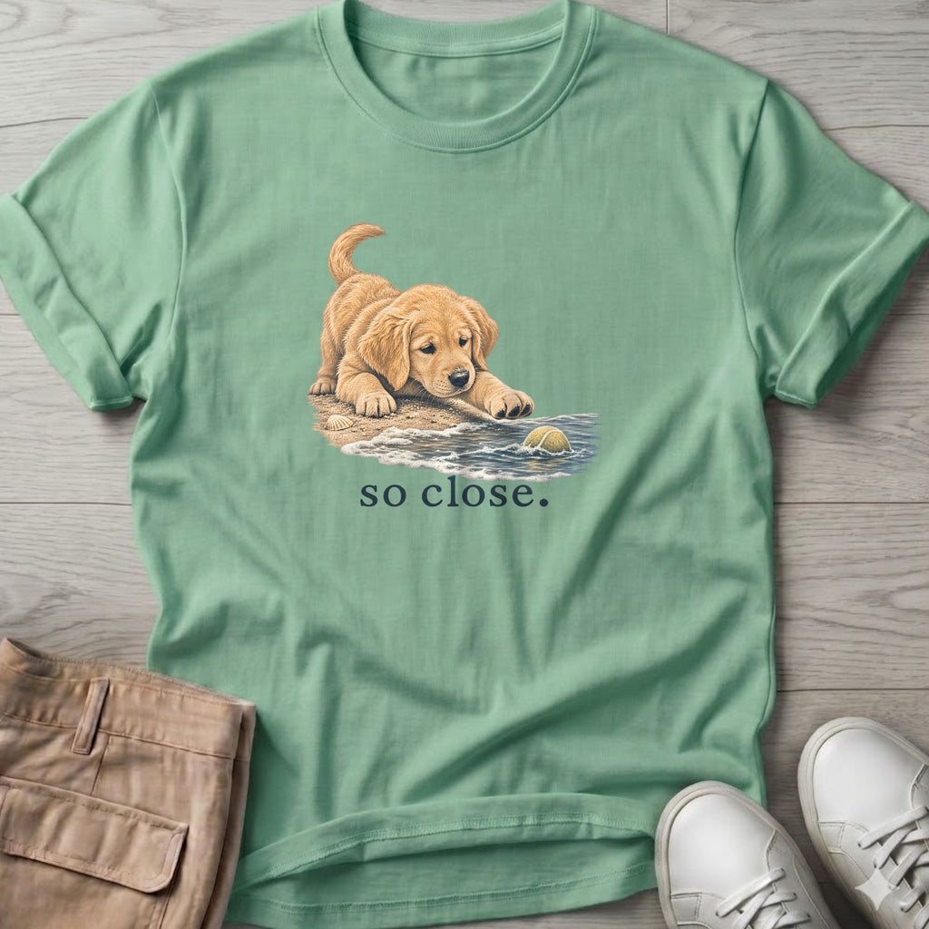 So Close Golden Retriever Puppy 2 T-Shirt in Mint Green, Salty Paws Soft Style T-Shirt, front design flat lay