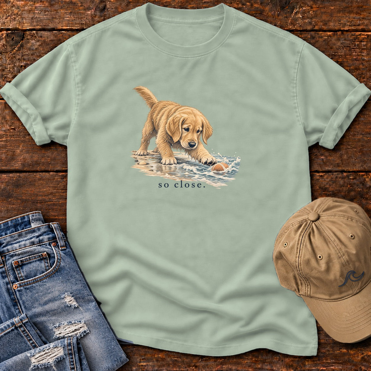So Close Golden Retriever Puppy T-Shirt in Bay, Salty Paws Comfort Colors T-Shirt, front design flat lay