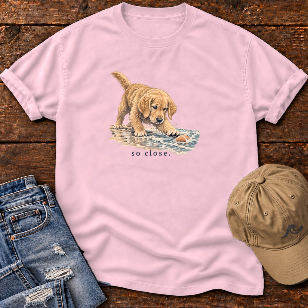 So Close Golden Retriever Puppy T-Shirt in Blossom, Salty Paws Comfort Colors T-Shirt, front design flat lay