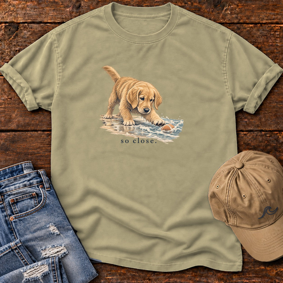 So Close Golden Retriever Puppy T-Shirt in Khaki, Salty Paws Comfort Colors T-Shirt, front design flat lay