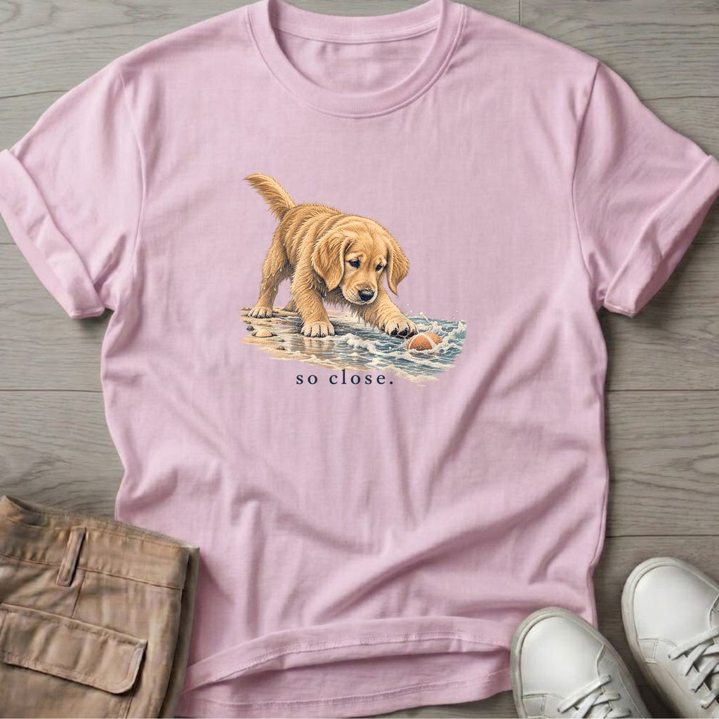 So Close Golden Retriever Puppy T-Shirt in Light Pink, Salty Paws Soft Style T-Shirt, front design flat lay