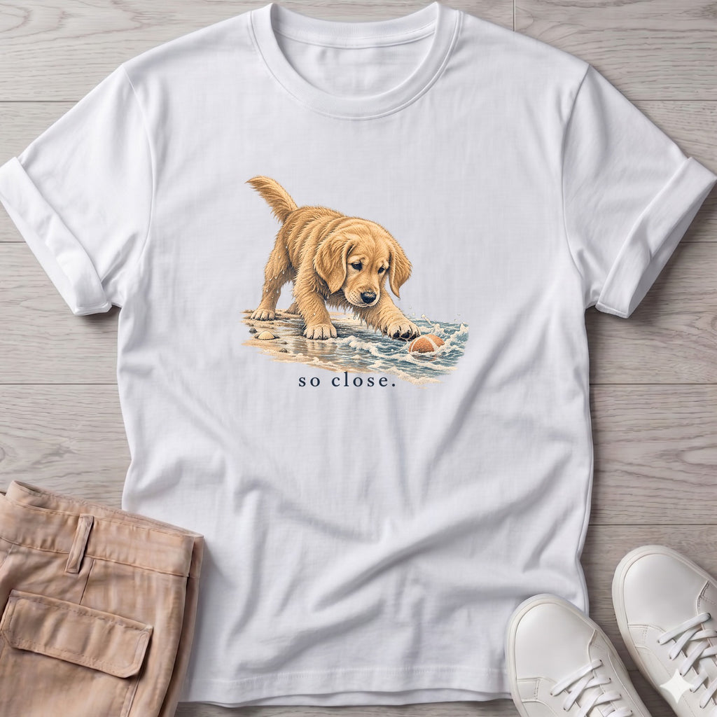So Close Golden Retriever Puppy T-Shirt in White, Salty Paws Soft Style T-Shirt, front design flat lay
