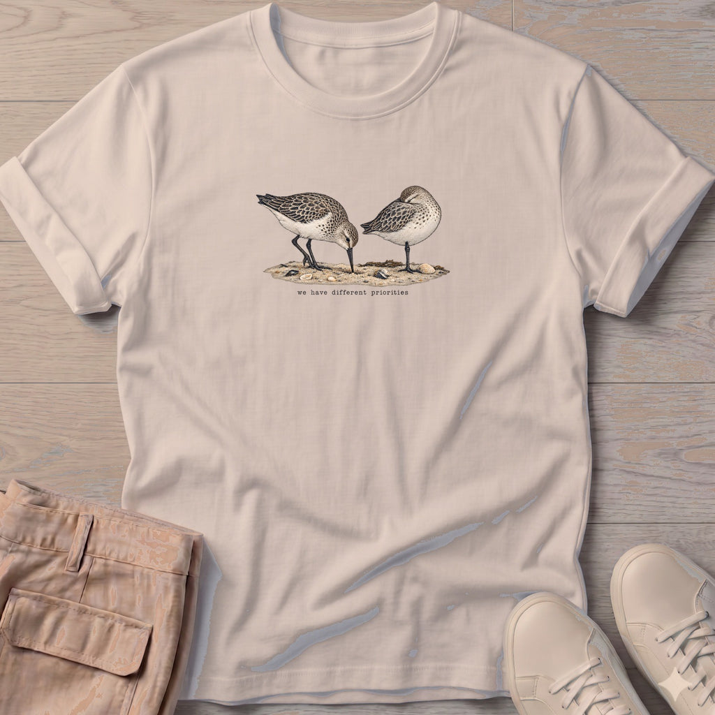 We Have Different Priorities Sandpipers T-Shirt in Sand, Salty Paws Soft Style T-Shirt, front design flat lay